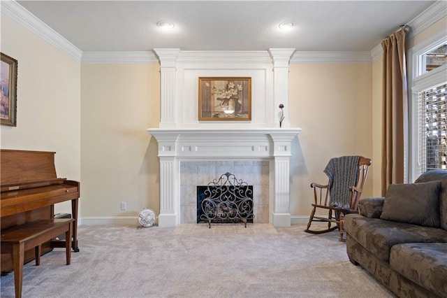 carpeted living room with ornamental molding, a fireplace, and baseboards