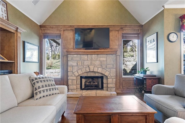 living room with a healthy amount of sunlight, ornamental molding, vaulted ceiling, and dark wood-type flooring