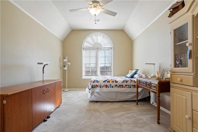 bedroom with lofted ceiling, light colored carpet, and visible vents