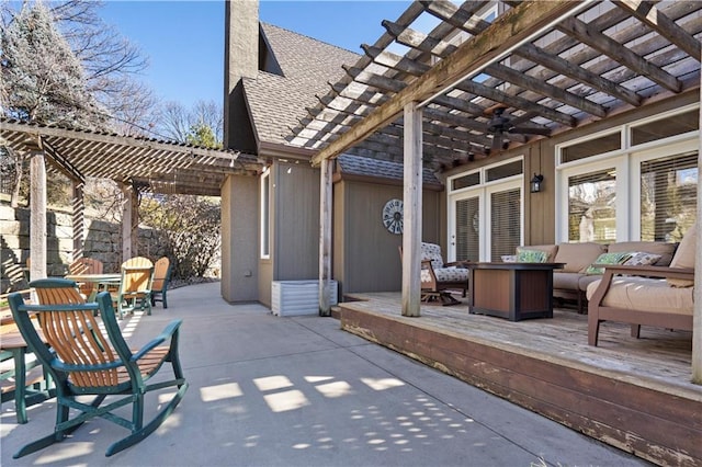 view of patio / terrace with ceiling fan, a pergola, and an outdoor living space with a fire pit