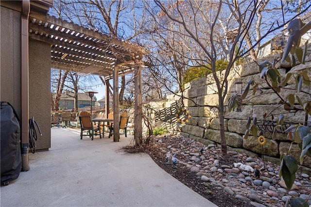 view of patio / terrace featuring fence, outdoor dining area, and a pergola