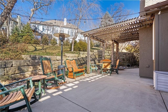 view of patio featuring fence and a pergola