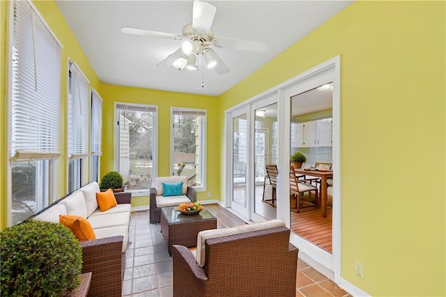 sunroom with a ceiling fan