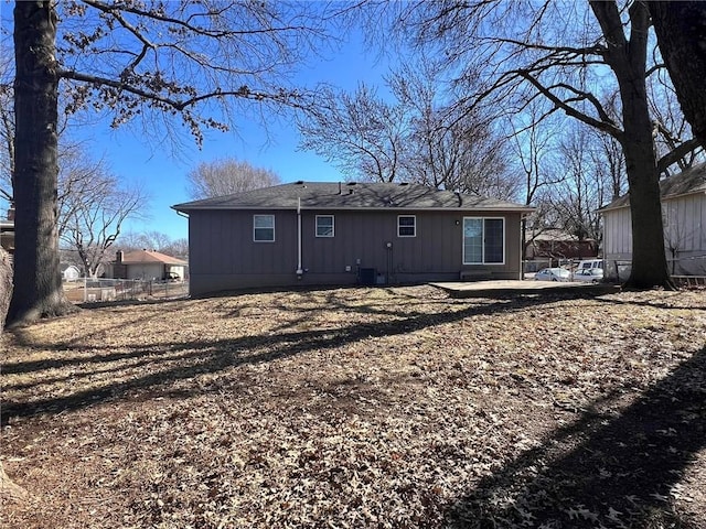 back of property featuring fence, central AC, and a patio