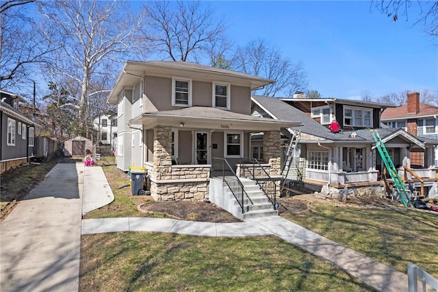 view of front facade with covered porch, stucco siding, concrete driveway, an outdoor structure, and stone siding