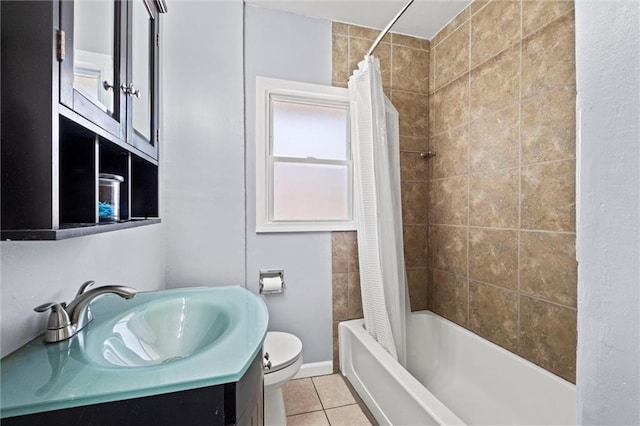 bathroom with vanity, tile patterned floors, toilet, and shower / bath combo