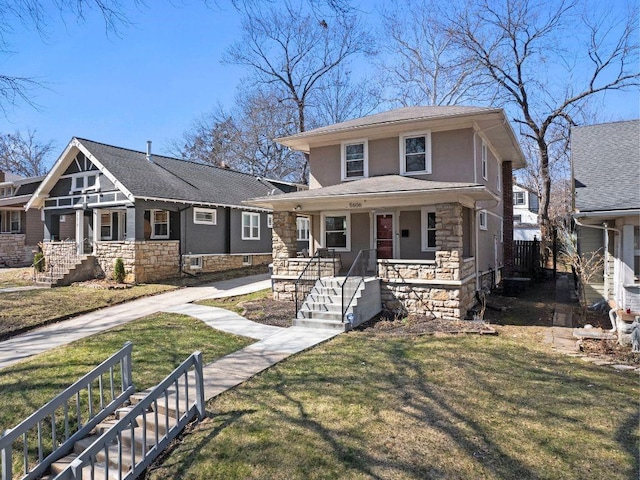 traditional style home featuring stone siding, stucco siding, a porch, and a front lawn