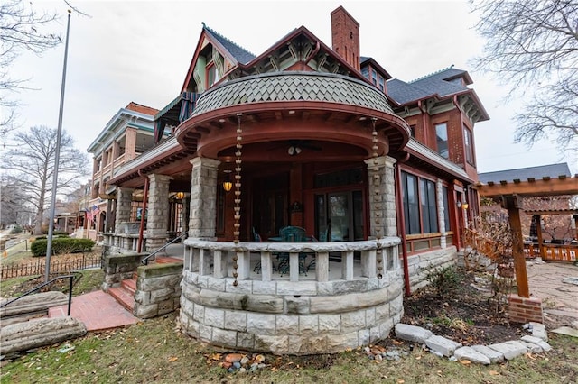 back of property with a chimney