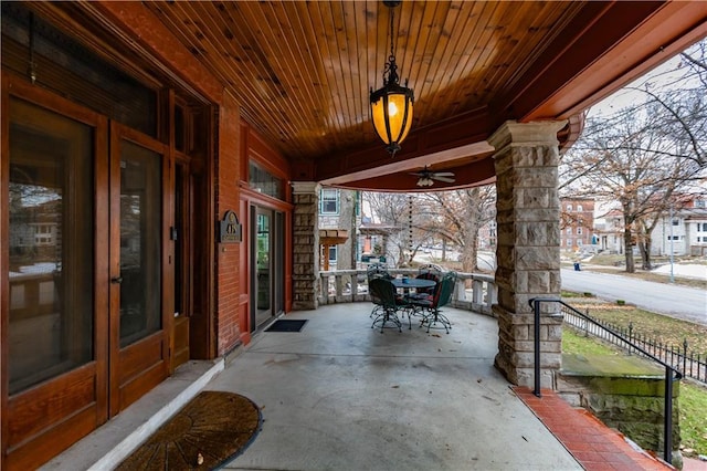 view of patio with fence and outdoor dining area