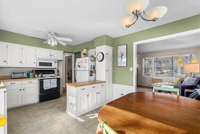 kitchen with decorative backsplash, white appliances, a ceiling fan, light countertops, and white cabinets