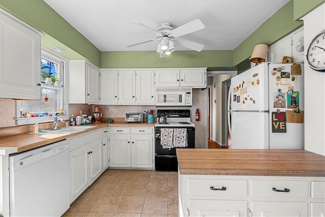kitchen featuring ceiling fan, white appliances, white cabinetry, and backsplash