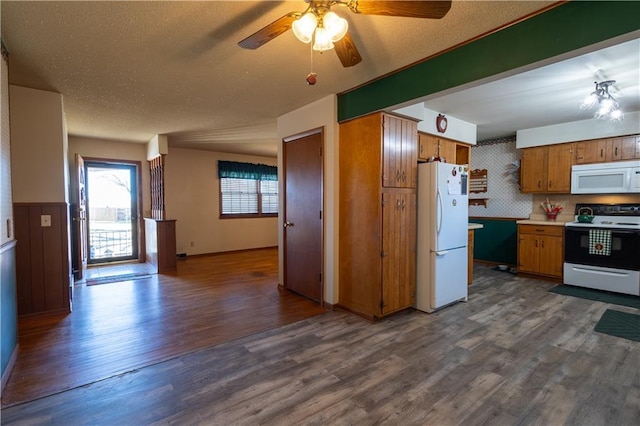 kitchen with white appliances, dark wood-style floors, ceiling fan, a textured ceiling, and brown cabinets