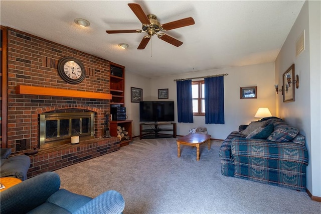 carpeted living area featuring visible vents, a fireplace, and a ceiling fan