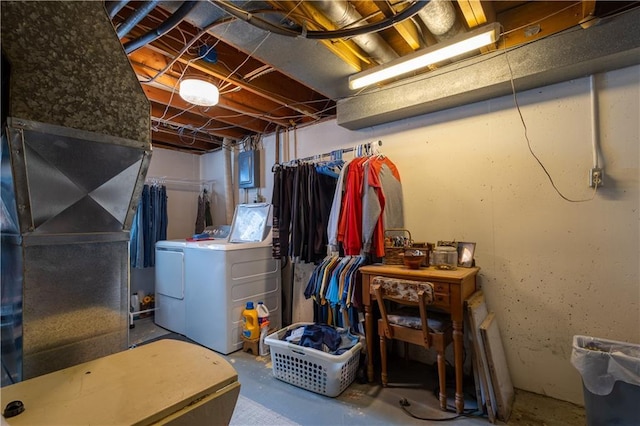 unfinished below grade area with washer and clothes dryer