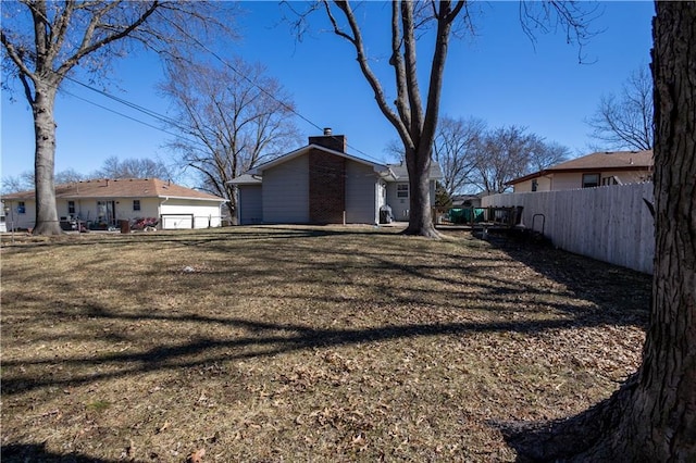 view of yard featuring fence