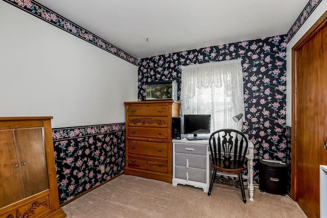 carpeted home office featuring wallpapered walls