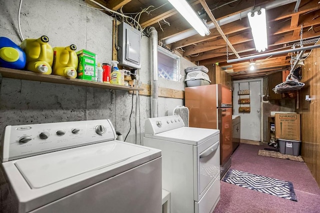 washroom with separate washer and dryer, laundry area, and electric panel