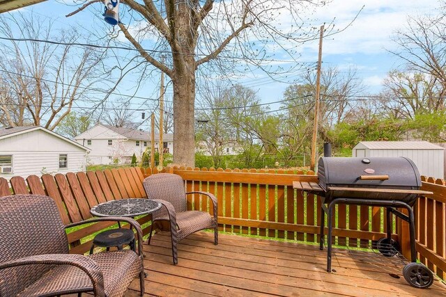 deck with grilling area and fence