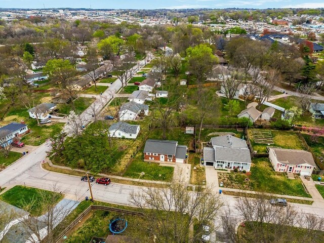 birds eye view of property with a residential view