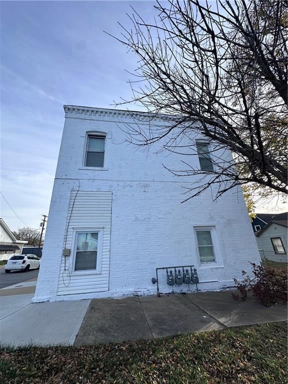 exterior space with brick siding