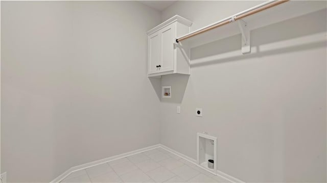 laundry area featuring washer hookup, hookup for an electric dryer, cabinet space, and baseboards