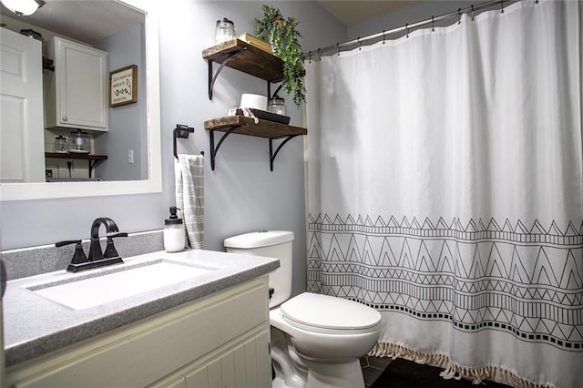 full bathroom with vanity and toilet