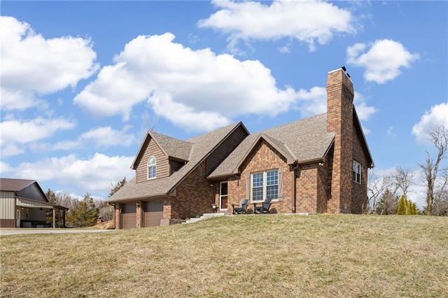 view of front facade with brick siding, a front lawn, roof with shingles, a chimney, and an attached garage