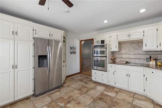 kitchen with a ceiling fan, recessed lighting, stainless steel appliances, white cabinets, and backsplash