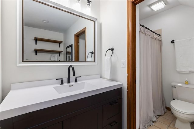 full bathroom featuring vanity, tile patterned floors, toilet, and lofted ceiling