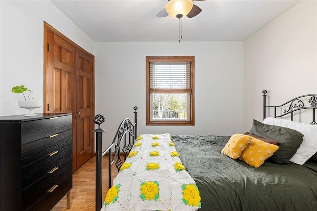 bedroom featuring ceiling fan and light wood-style floors