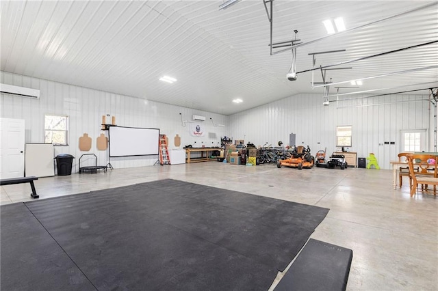 garage with metal wall and an AC wall unit