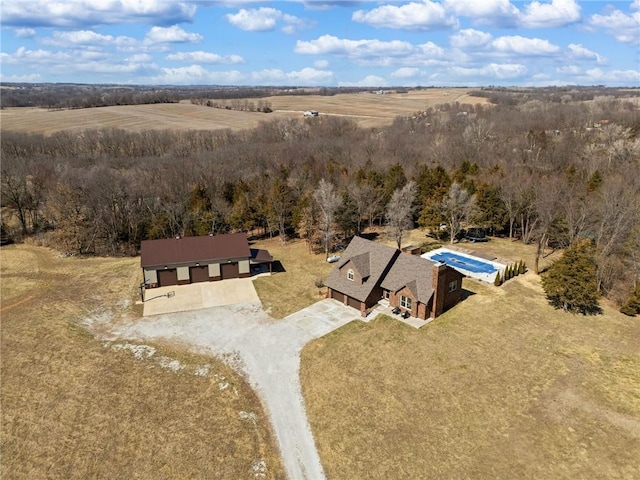 birds eye view of property with a rural view