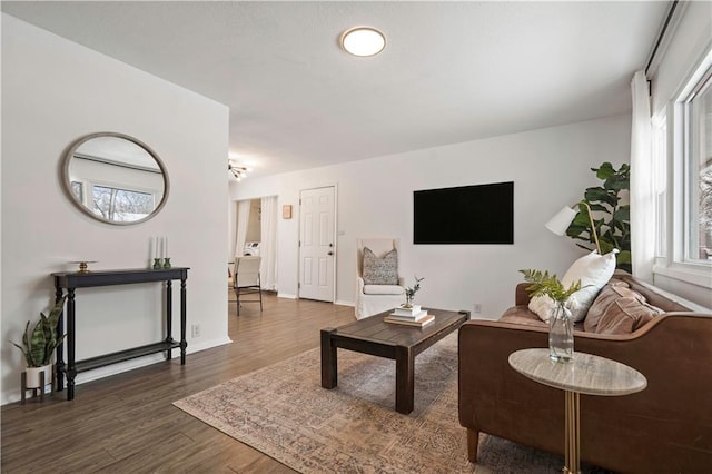 living room featuring wood finished floors and baseboards