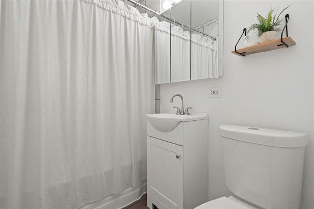 bathroom featuring vanity, toilet, and shower / bathtub combination with curtain