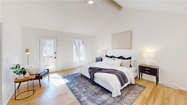 bedroom featuring access to exterior, light wood finished floors, visible vents, high vaulted ceiling, and beamed ceiling