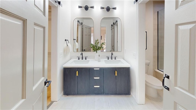 full bathroom featuring a sink, toilet, and double vanity