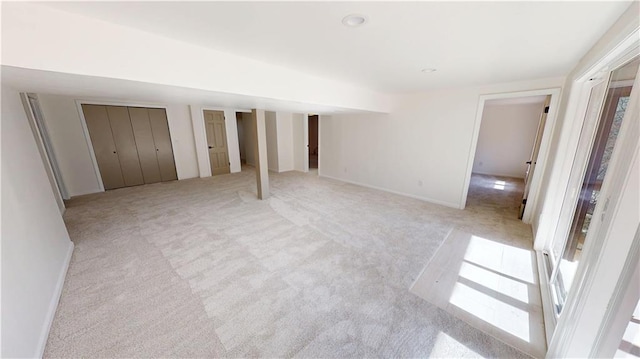 unfurnished bedroom with light carpet and two closets