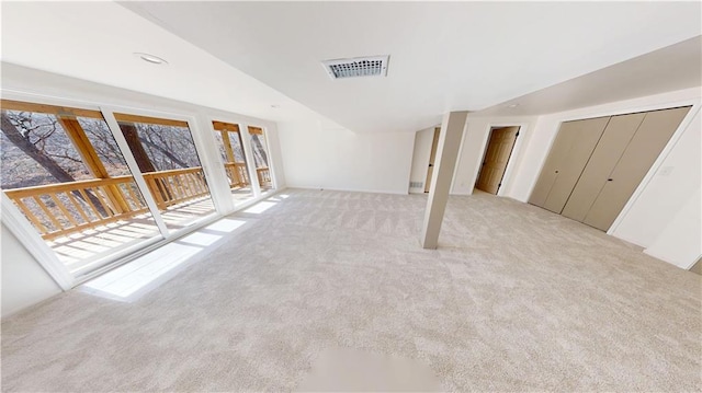 interior space with recessed lighting, visible vents, and light carpet