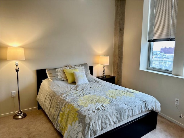 bedroom with baseboards and carpet flooring