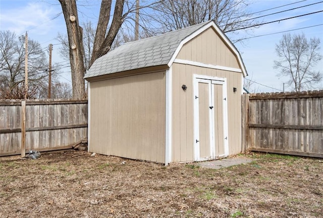 view of shed featuring a fenced backyard