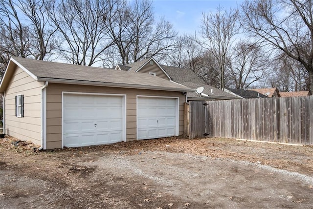 detached garage with fence