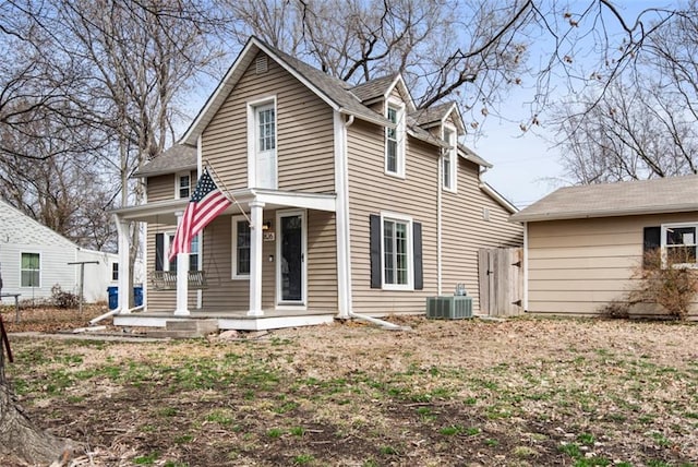 view of front of house with covered porch and central AC