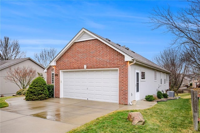 view of side of property featuring concrete driveway, an attached garage, cooling unit, a yard, and brick siding