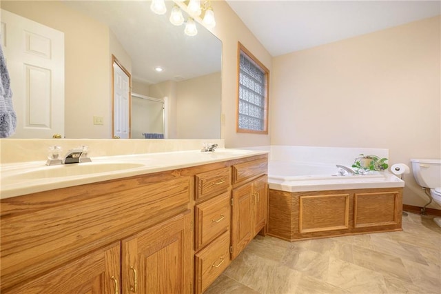 full bathroom featuring a sink, a shower stall, toilet, and a bath