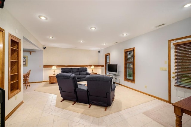 living room featuring light tile patterned floors, baseboards, visible vents, and recessed lighting