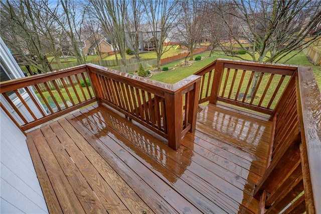 deck featuring a residential view, a fenced backyard, and a yard