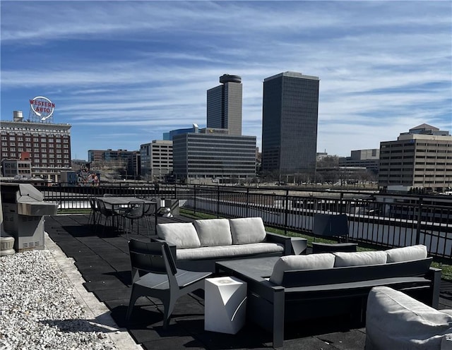 view of patio / terrace with a view of city and an outdoor hangout area