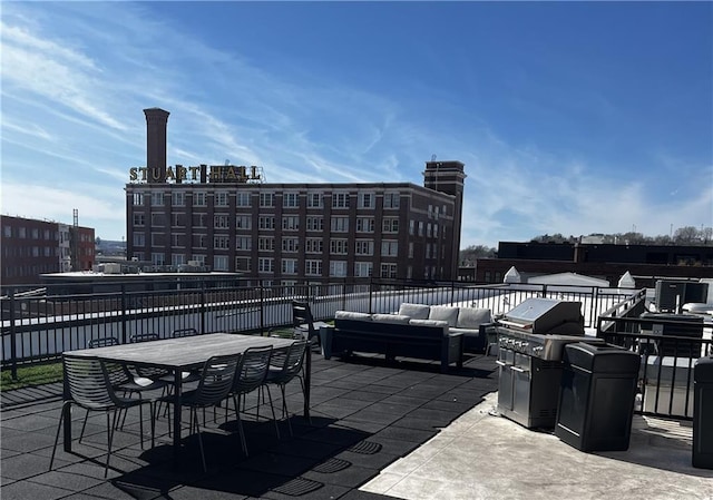 view of patio featuring a view of city, an outdoor hangout area, and area for grilling