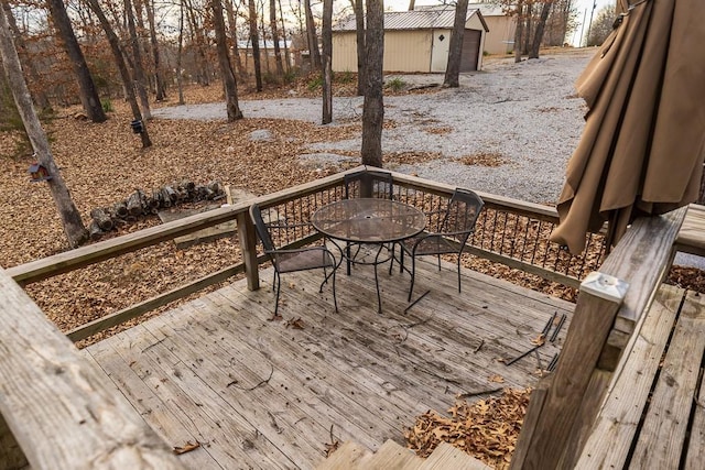 wooden terrace featuring outdoor dining space