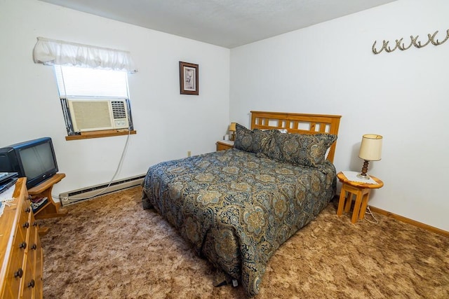 carpeted bedroom with a baseboard heating unit and baseboards